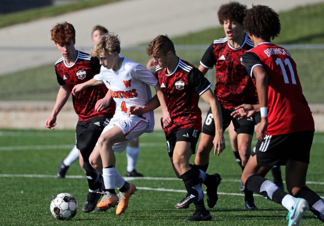 West De Pere High School's Grayson Birder (4) controls the ball against Union Grove High School defenders during their WIAA Division 2 boys soccer championship game Saturday, November 4, 2023, at Uihlein Soccer Park in Milwaukee, Wis.