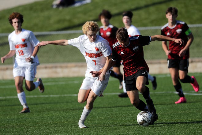 West De Pere High School's Landen Arnstad (7) battles for control of the ball against Union Grove High School's Niall Hagen (9) during their WIAA Division 2 boys soccer championship game Saturday, November 4, 2023, at Uihlein Soccer Park in Milwaukee, Wis.