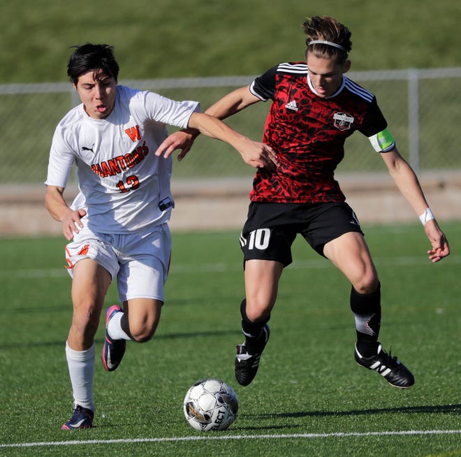 West De Pere High School's Johan Hernandez (13) gains control of the ball against Union Grove High School's Tyler Hagen (10) during their WIAA Division 2 boys soccer championship game Saturday, November 4, 2023, at Uihlein Soccer Park in Milwaukee, Wis.