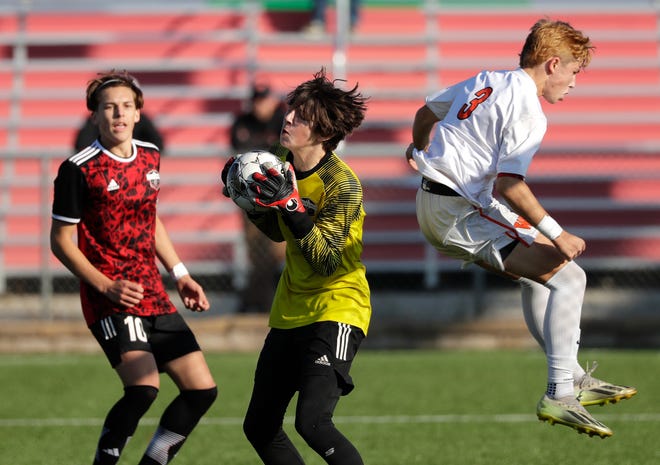 Union Grove High School's Finn Jacobs (1) makes a save as West De Pere High School's Tyler Kowalczyk (3) tries to score a goal during their WIAA Division 2 boys soccer championship game Saturday, November 4, 2023, at Uihlein Soccer Park in Milwaukee, Wis.